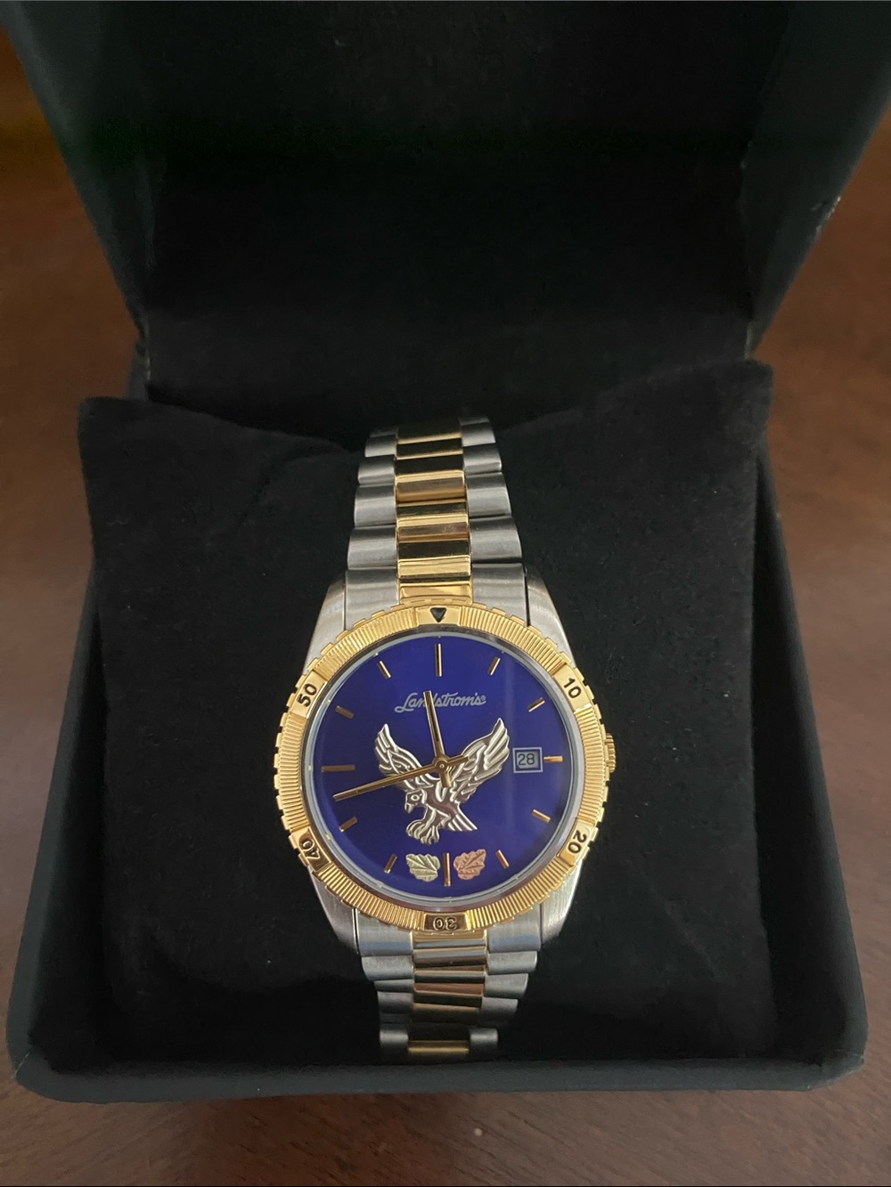 Landstrom’s Black Gold Watch with Blue Dial and Eagle Motif two tone band